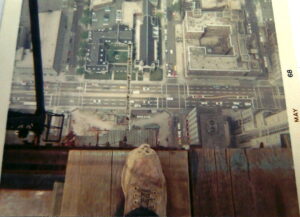 Iron worker on top of the Hancock Building, no safety tie off, overlooking Michigan Avenue, Chicago (1968)